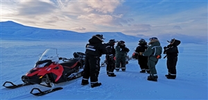 Snowmobiling in Svalbard by Daina